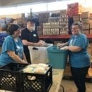 Coleman Insights employees volunteered at a food pantry as part of its Pledge 1% initiative